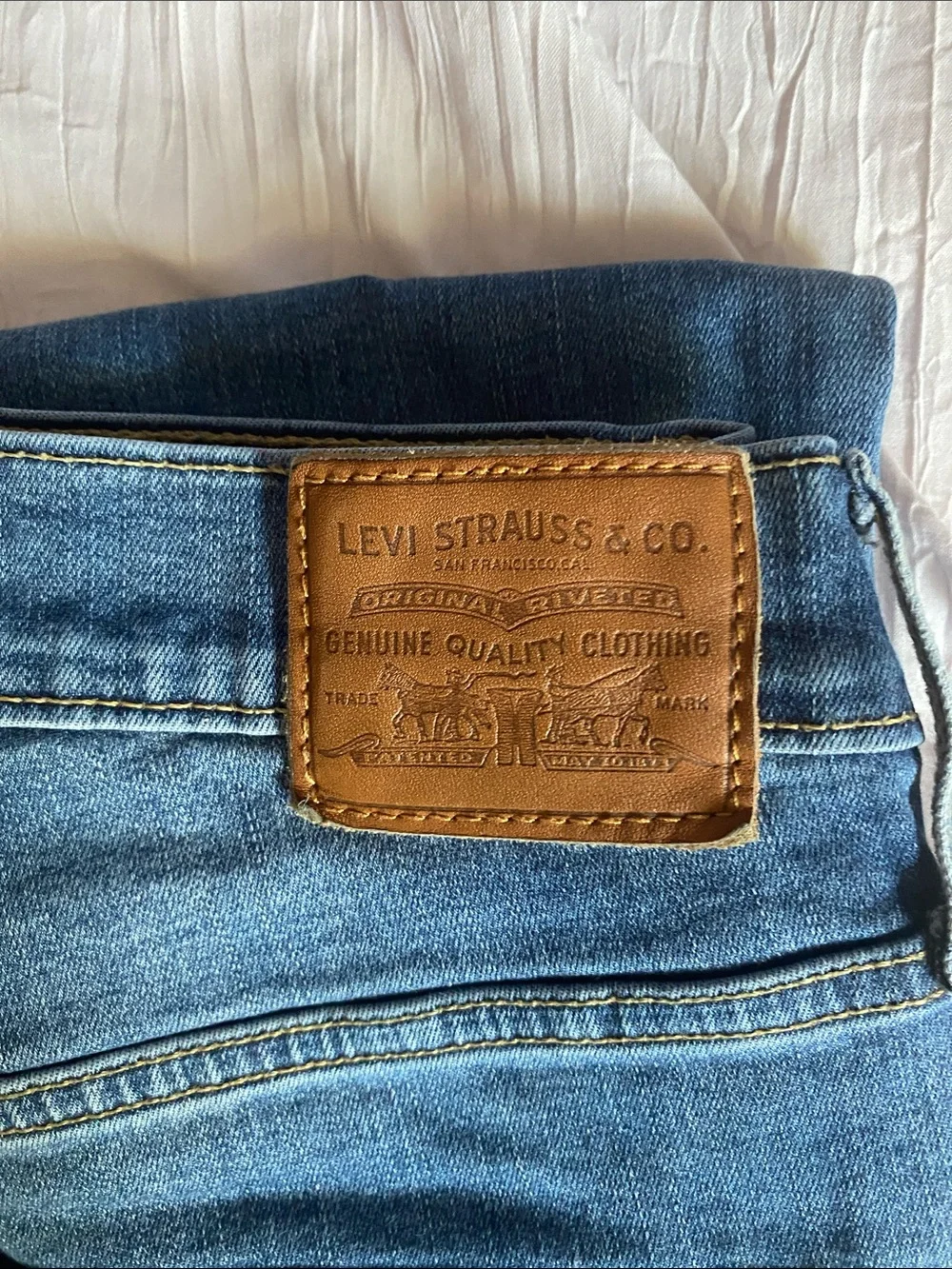 Levi's Slim Jeans in Medium Blue with Tan Patch